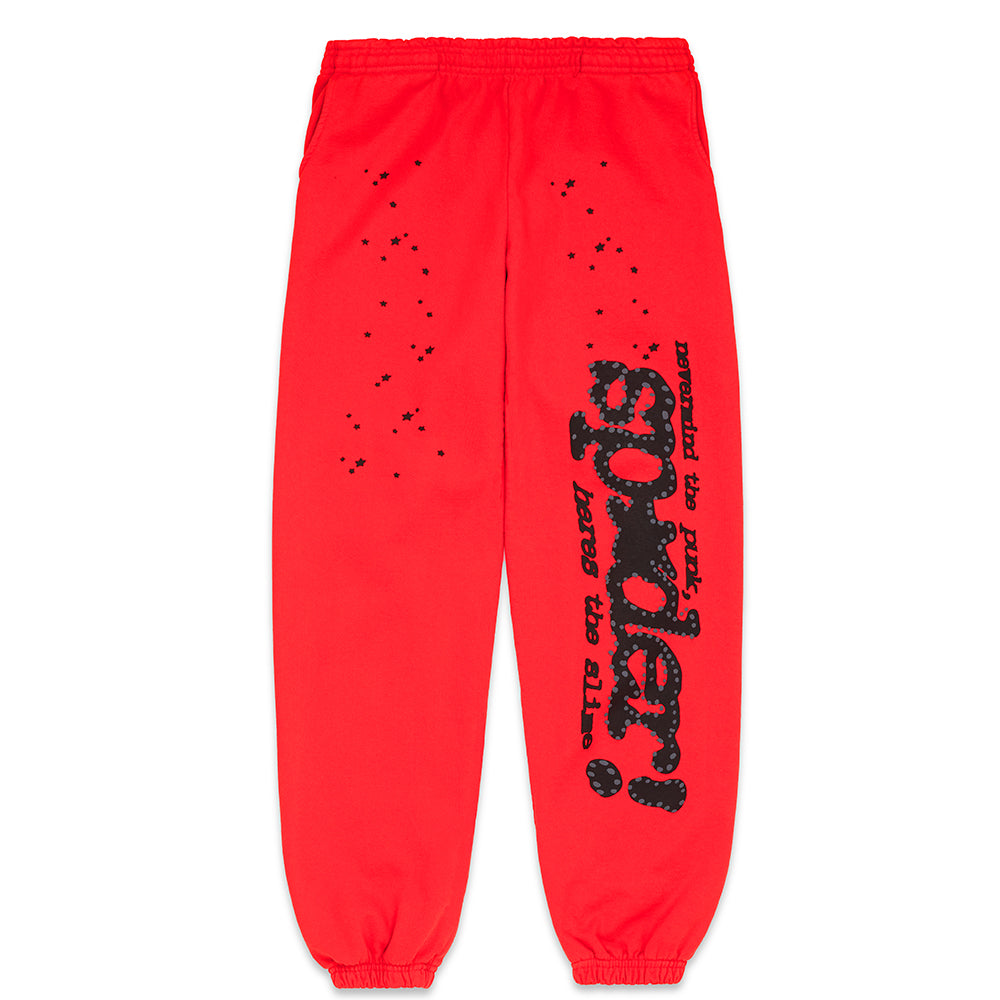 Red P*NK V2 sweatpants with black puff print "SP5DER" motif, stars, and "nevermind the punk, here's the slime" text.