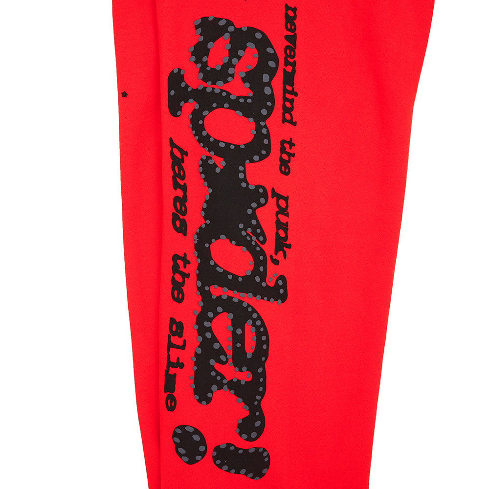 Red P*NK V2 SWEATPANT with black puff print "SP5DER" motif and star prints down the leg.