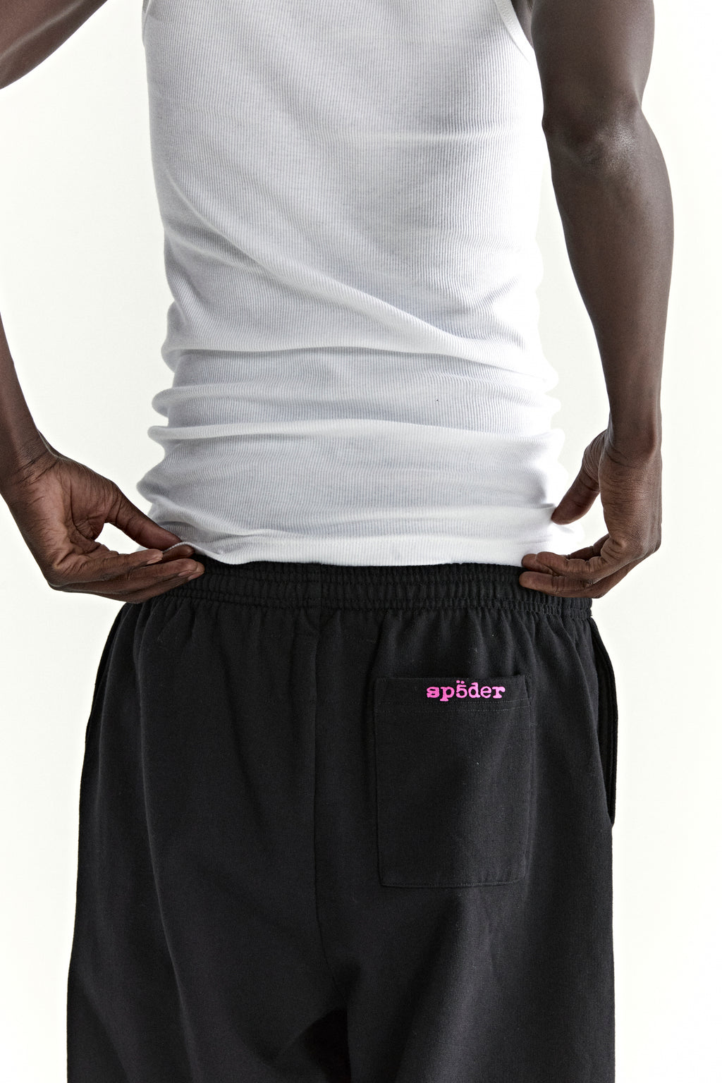 Black ARACH SWEATPANT with pink "sp5der" puff print on back pocket, 100% cotton fleece.