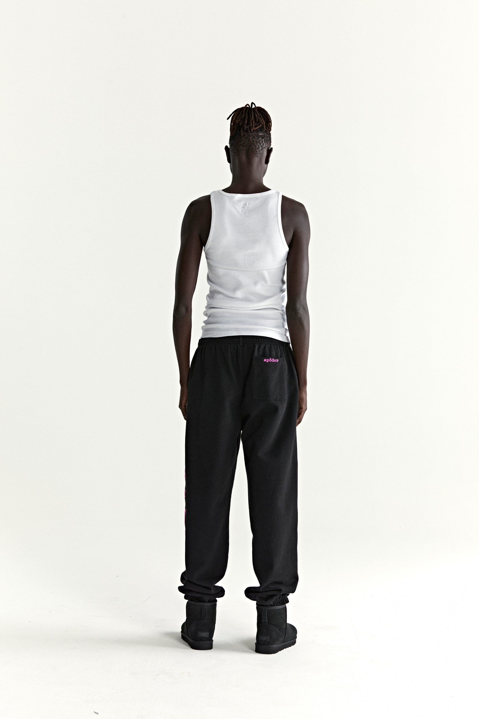 Black ARACH SWEATPANT with pink arched text print, 13oz cotton fleece, elasticized cuffs.