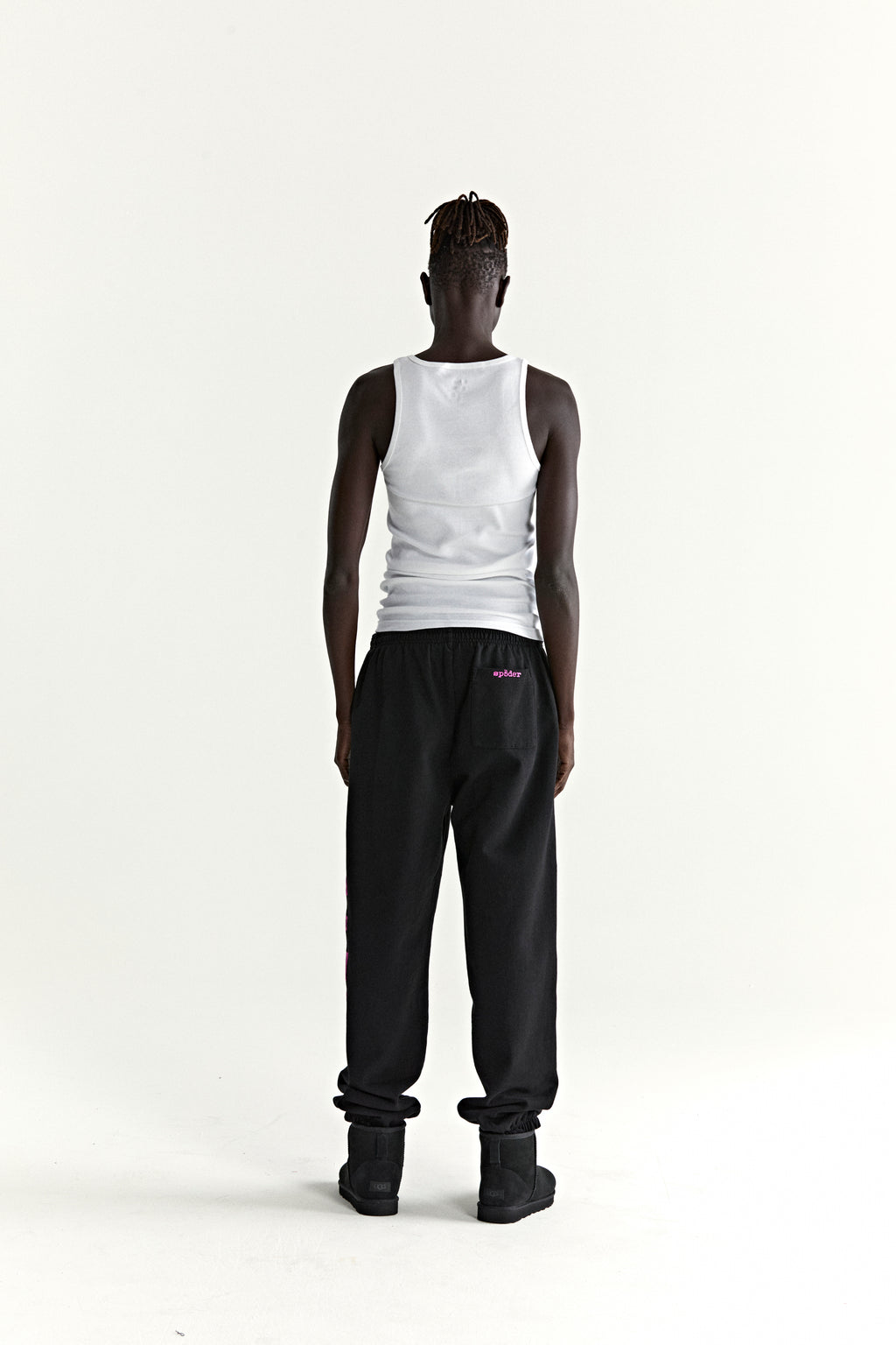 Black ARACH SWEATPANT with pink arched text print, 13oz cotton fleece, elasticized cuffs.