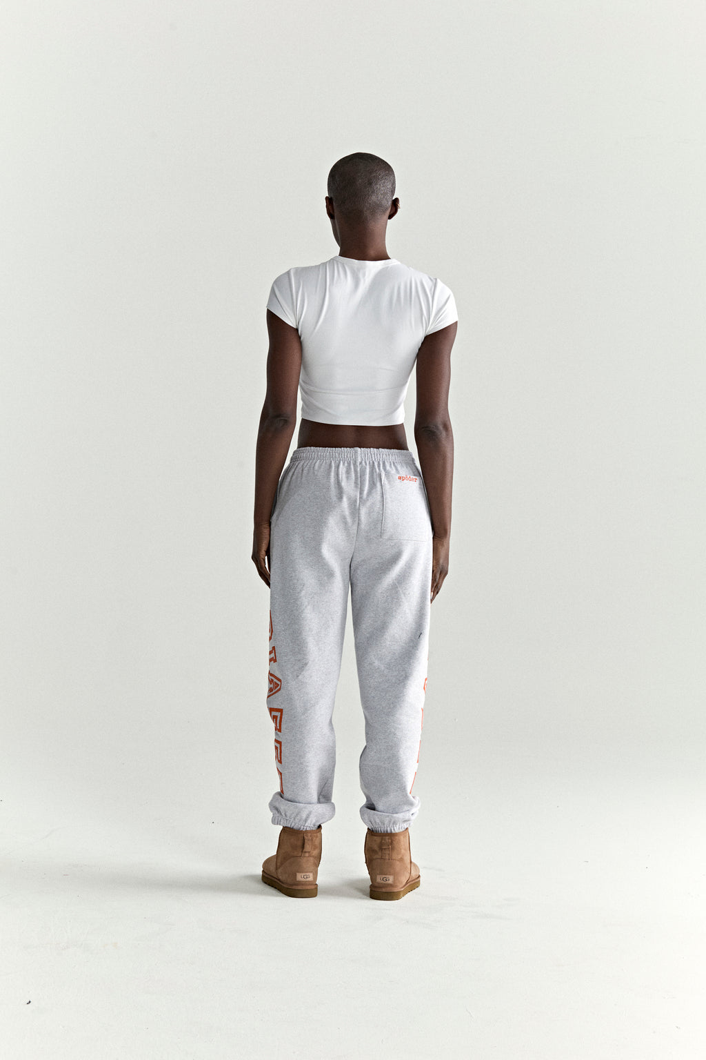 Gray ARACH SWEATPANT with arched orange text, 13oz cotton fleece, elasticized cuffs.