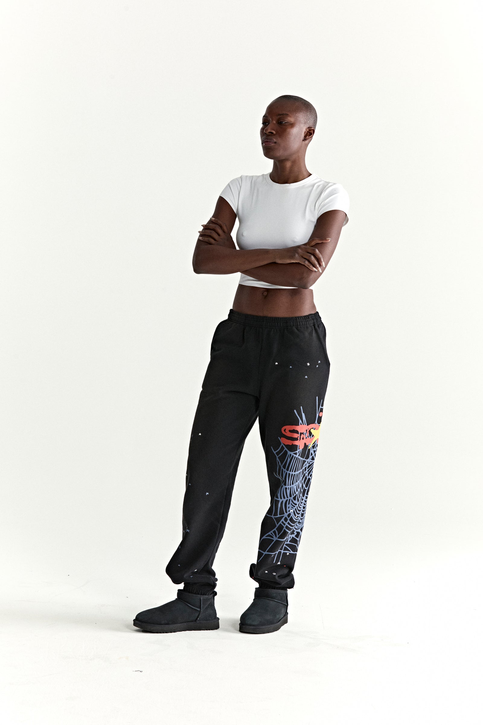 Black HEAVY WEB SWEATPANT with SP5DER web graphic, scattered stars, and elasticized cuffs.