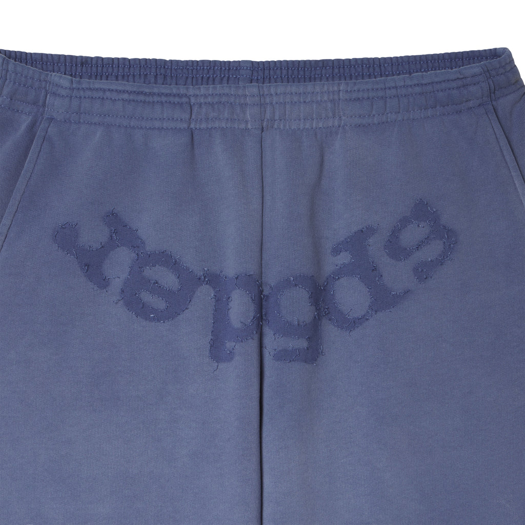 Blue cotton fleece sweatpants featuring distressed SP5DER graphic print at the crotch with an elasticized waistband.