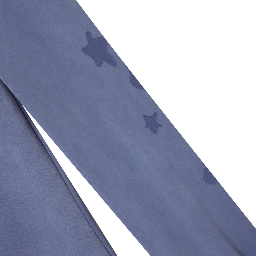 Beluga blue 100% cotton fleece sweatpants featuring a distressed star graphic print design along the leg.