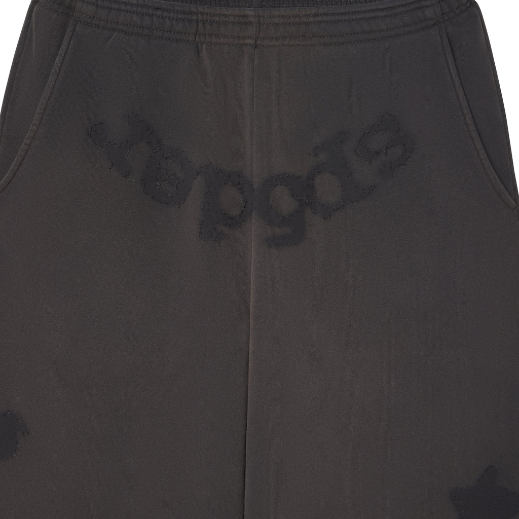 Beluga grey cotton fleece sweatpants featuring distressed SP5DER graphic print at the crotch and star design details.