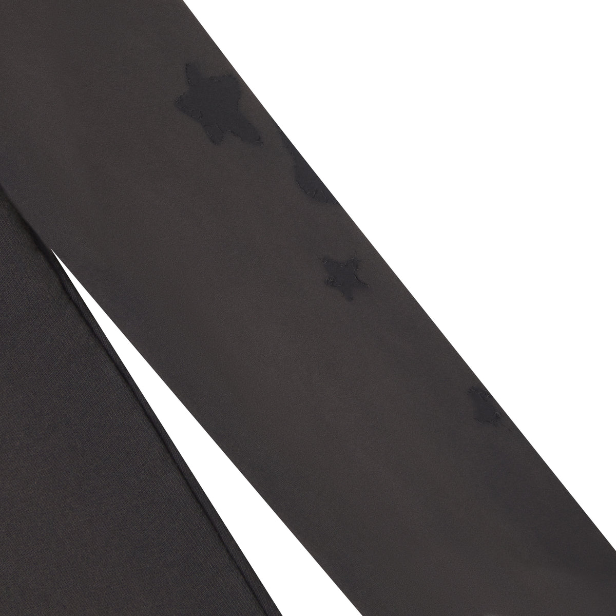Beluga grey 100% cotton fleece sweatpants featuring distressed star graphic designs along the leg.
