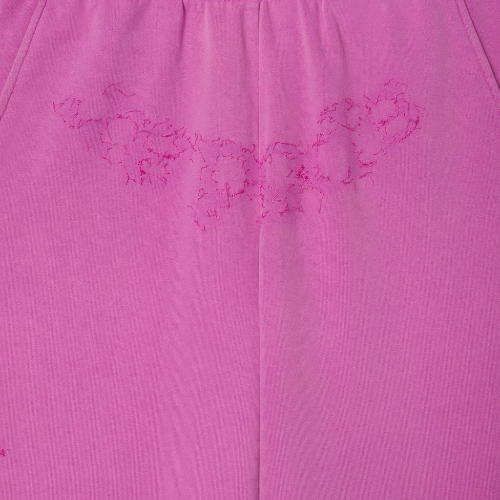 Pink 100% cotton fleece sweatpants featuring distressed SP5DER graphic print at the crotch.