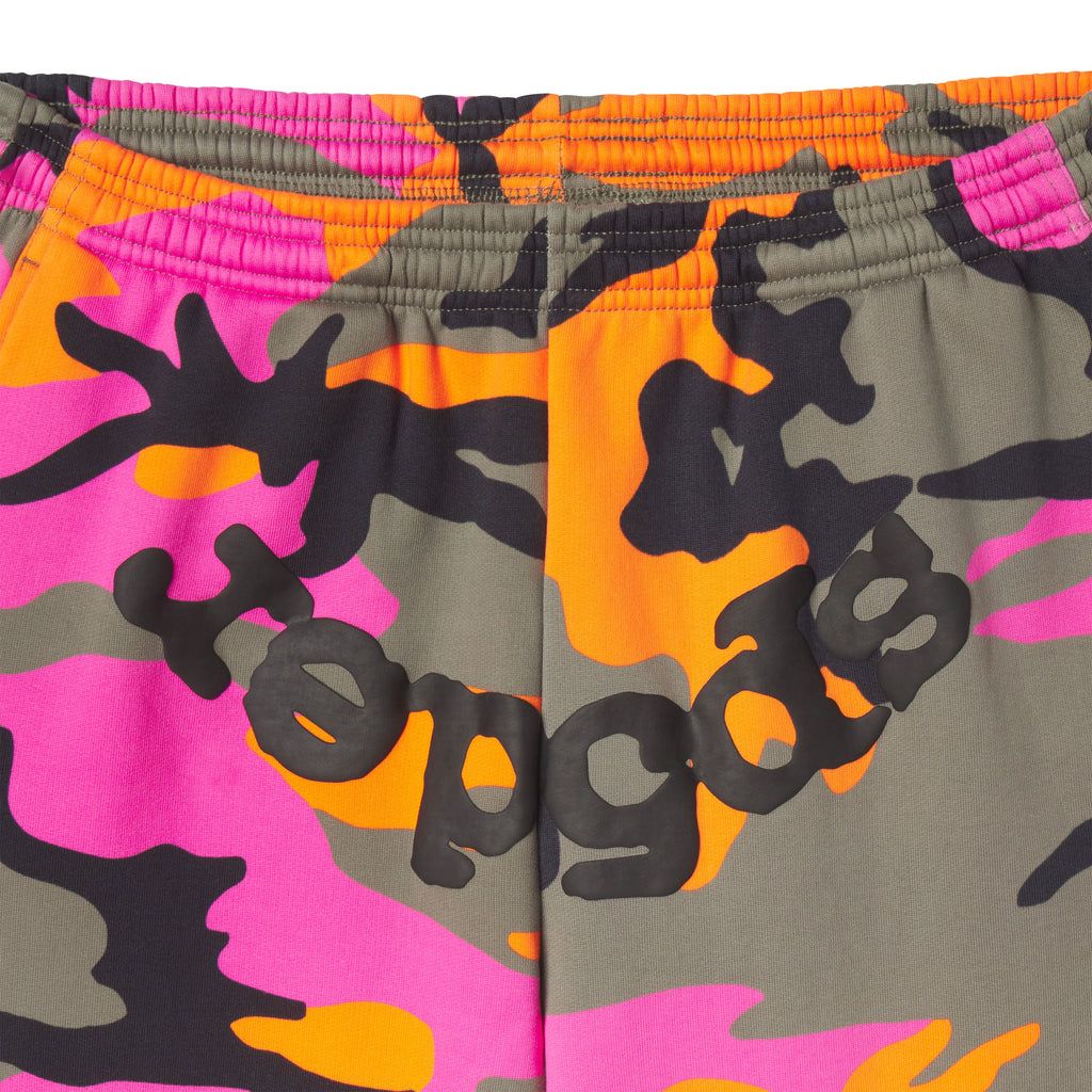 Adult camo sweatpants in pink, orange, and olive cotton fleece with a black puff print SP5DER graphic on the crotch.