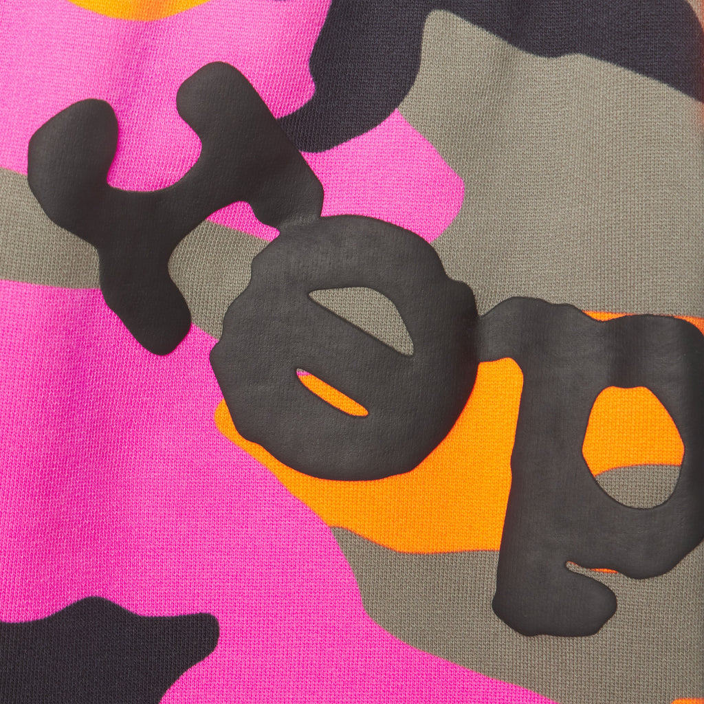 Pink, orange, and grey camo cotton fleece sweatpants featuring a black puff print graphic design.