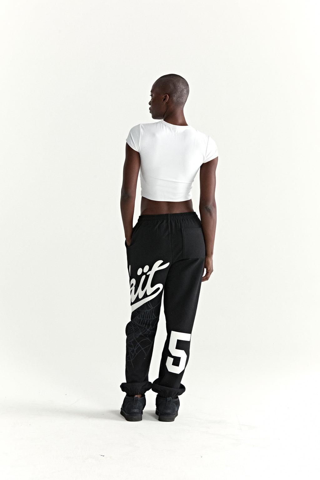 Black cotton fleece STADIUM SWEATPANT with white 'Wait' script, web print, and large '5' motif.