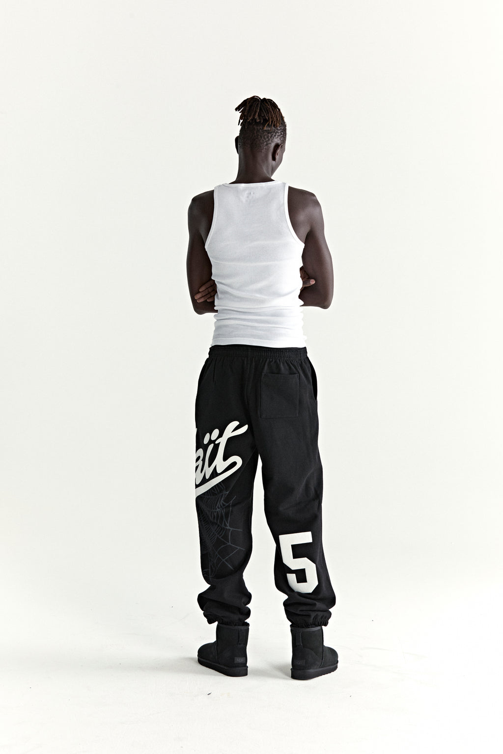 Black cotton fleece STADIUM SWEATPANT with "Wait" script, web print, and large "5" motif.