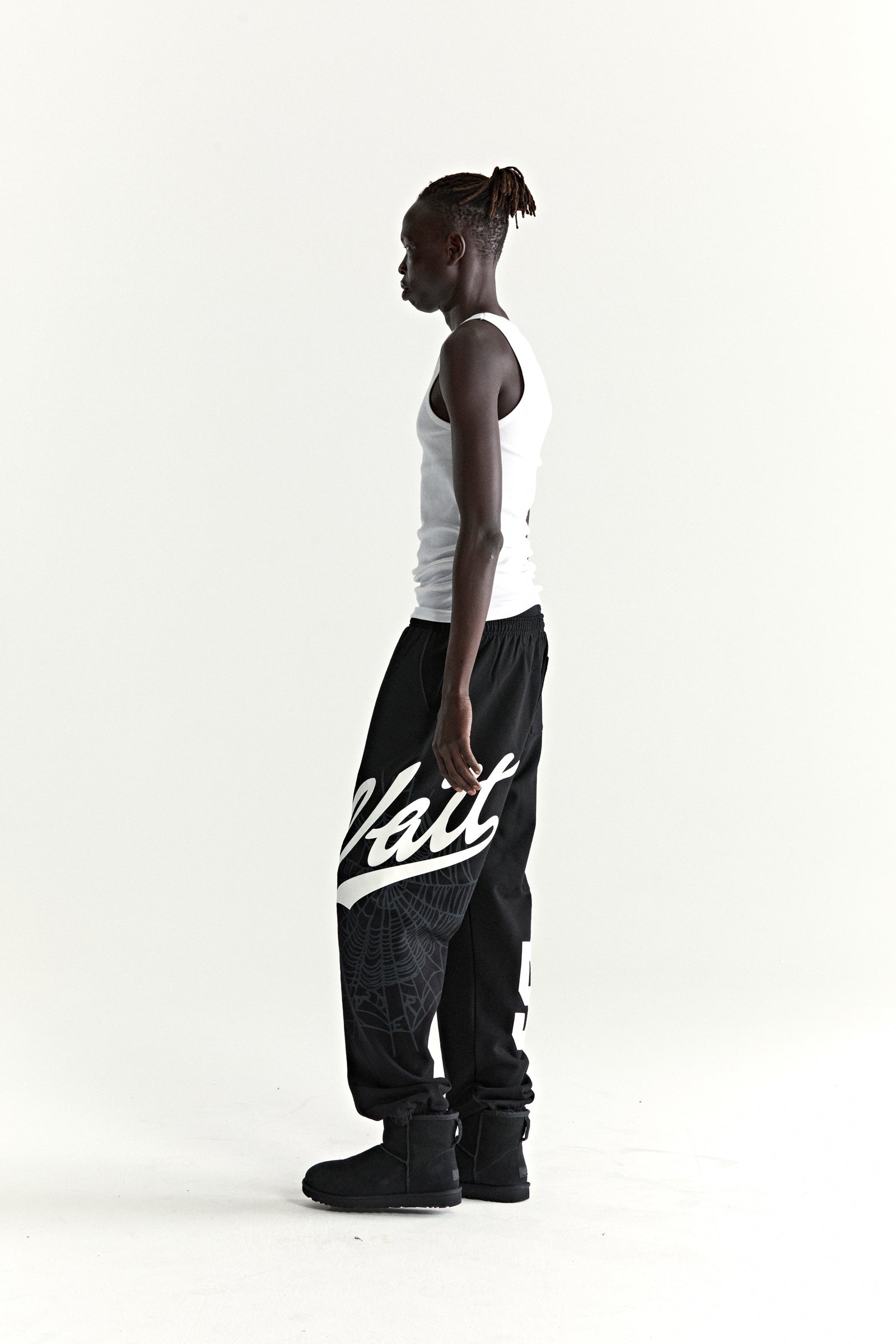Black cotton fleece STADIUM SWEATPANT with white 'Wait' script, web print, and '5' motif.