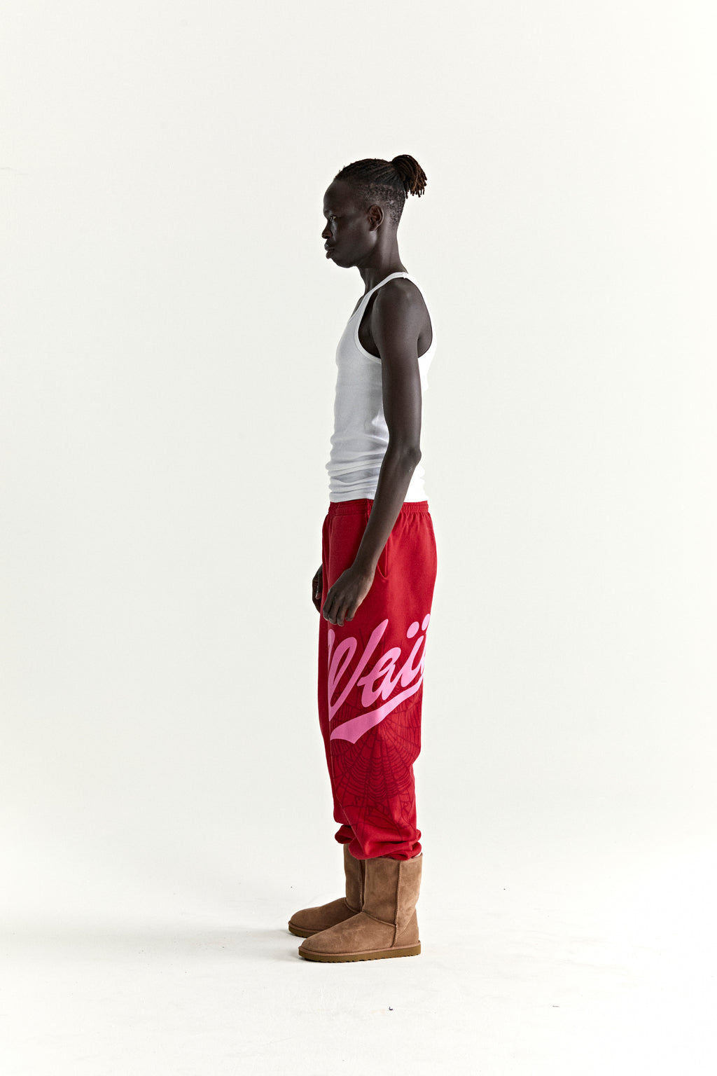 Red cotton fleece STADIUM SWEATPANT with pink 'Wait' script, web print, and '5' motif.