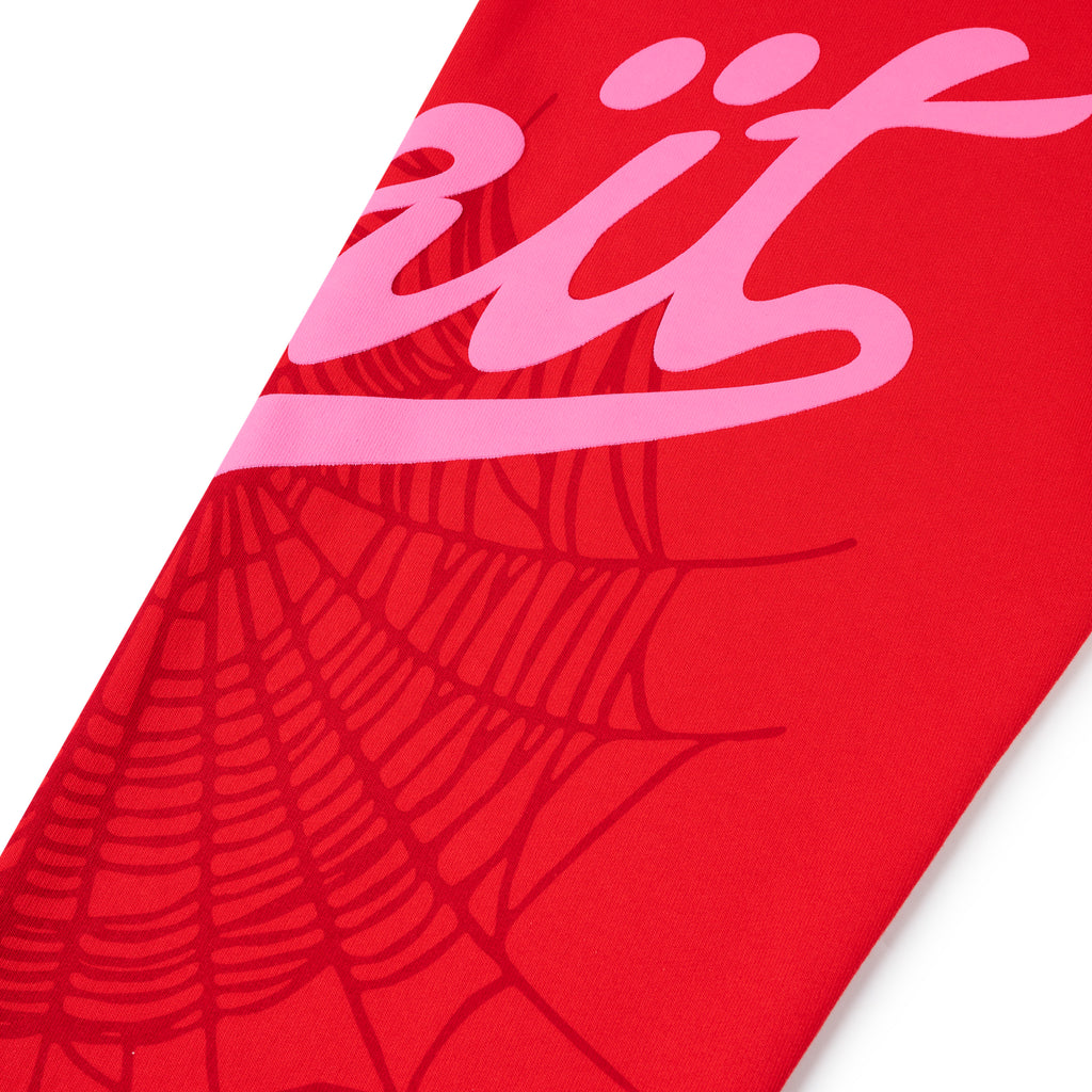 Red cotton fleece sweatpant with pink "Wait" script and spider web print.