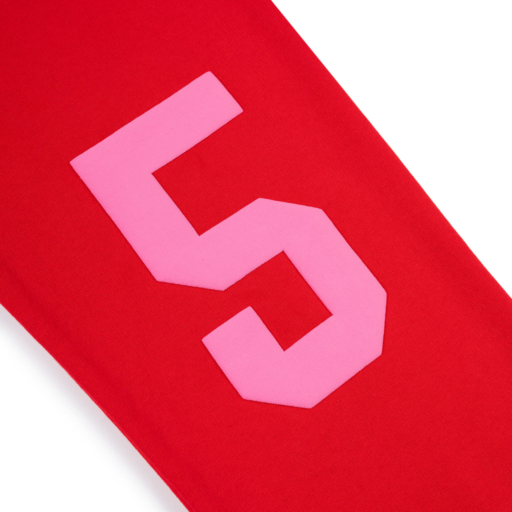 Red cotton fleece sweatpant with pink puff print '5' motif on back leg.
