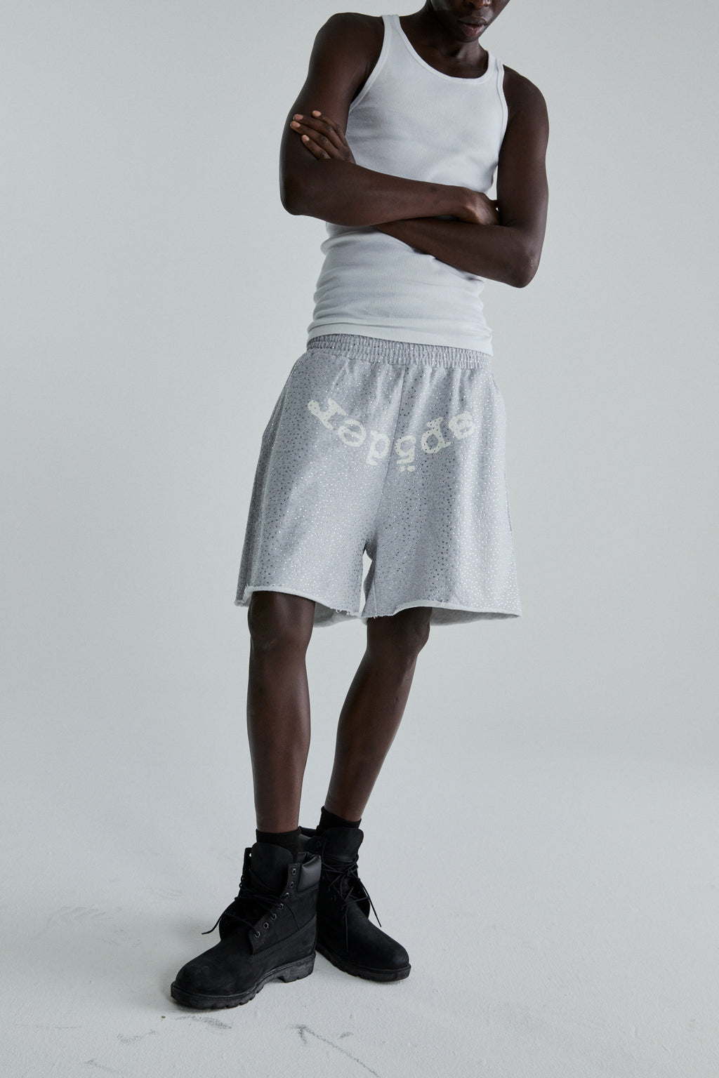 Gray VVS SWEATSHORT with tonal rhinestones, "SP5DER" text, drawstring waist, and raw hem.