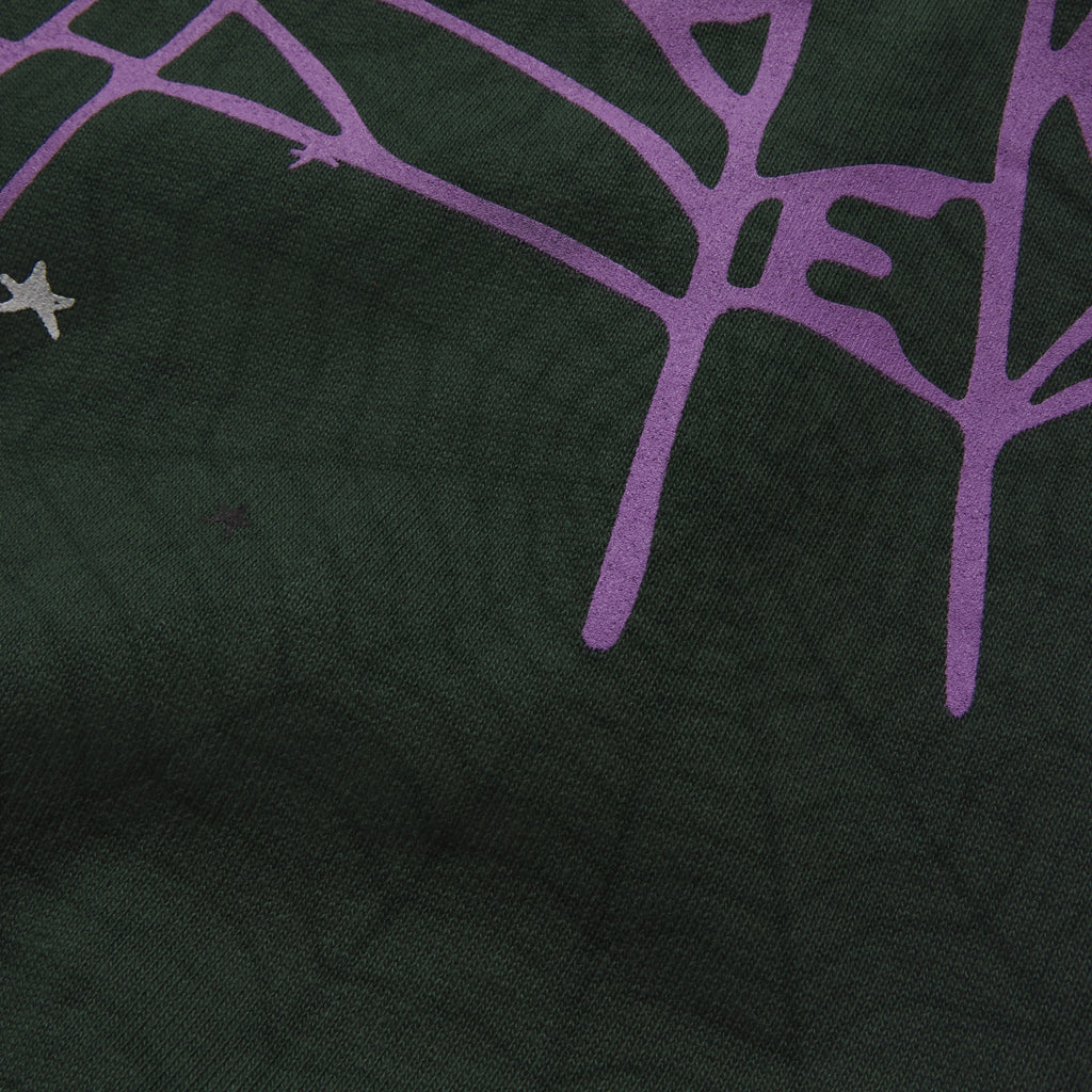 Dark green 13oz cotton fleece sweatpants featuring a purple SP5DER web graphic and scattered star print design.