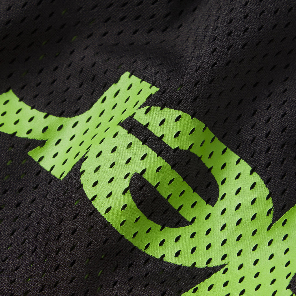 Black breathable mesh fabric featuring a bold neon green graphic print design.