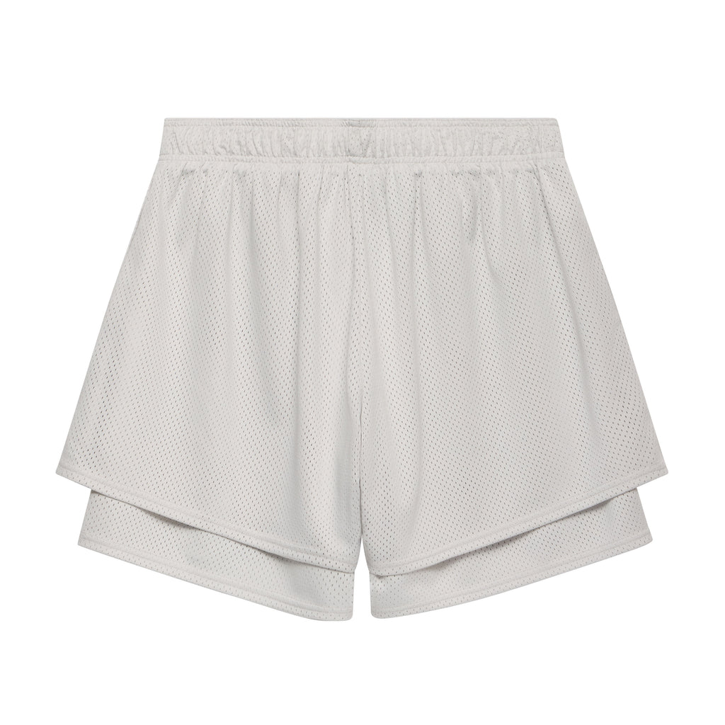 White double-layer mesh shorts with a high-low hem, elasticized waistband, and breathable athletic fabric construction.