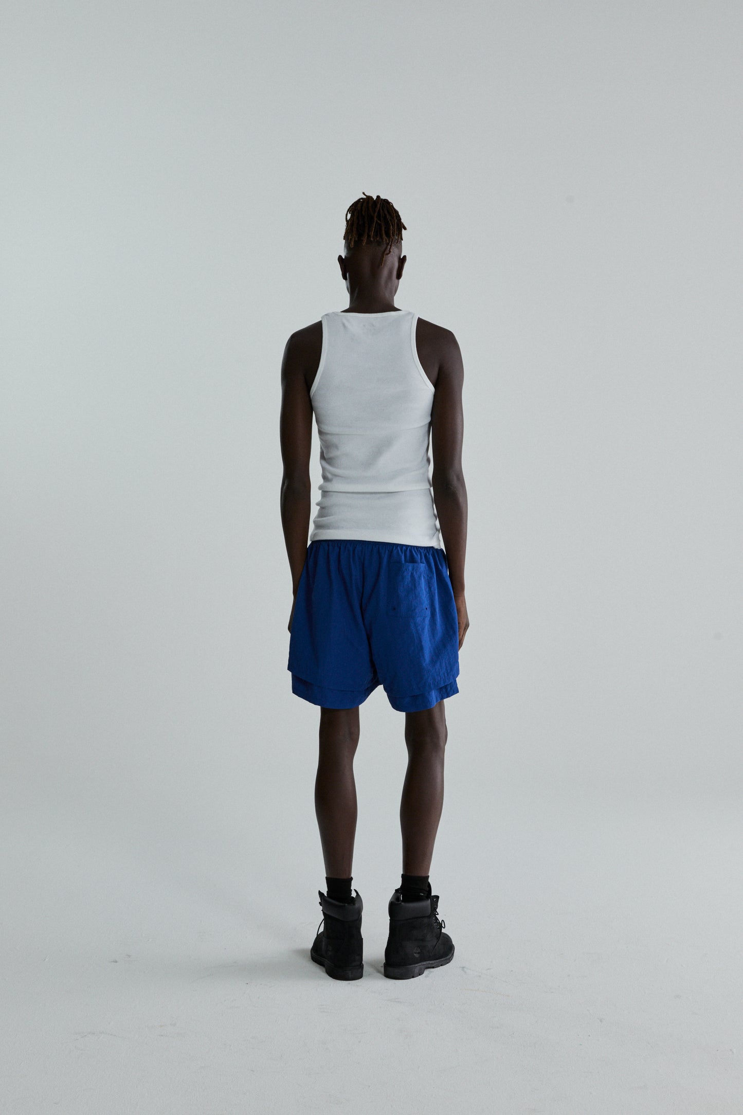 BLUE OG WEB DOUBLE LAYER SHORTS ON MODEL