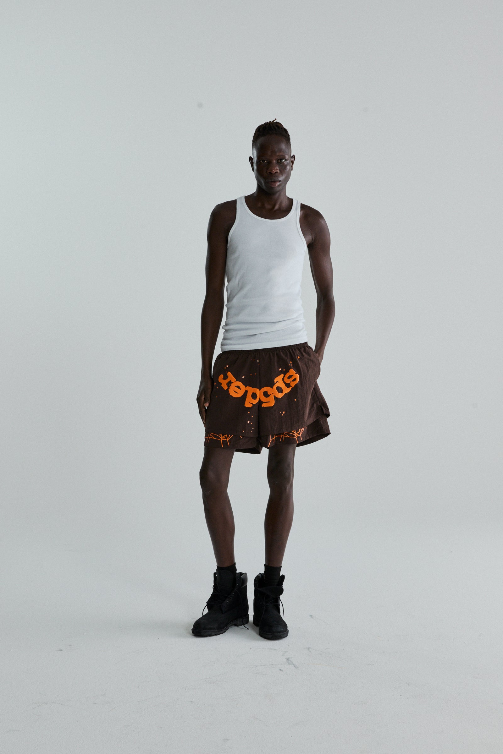 BROWN OG WEB DOUBLE LAYER SHORTS ON MODEL