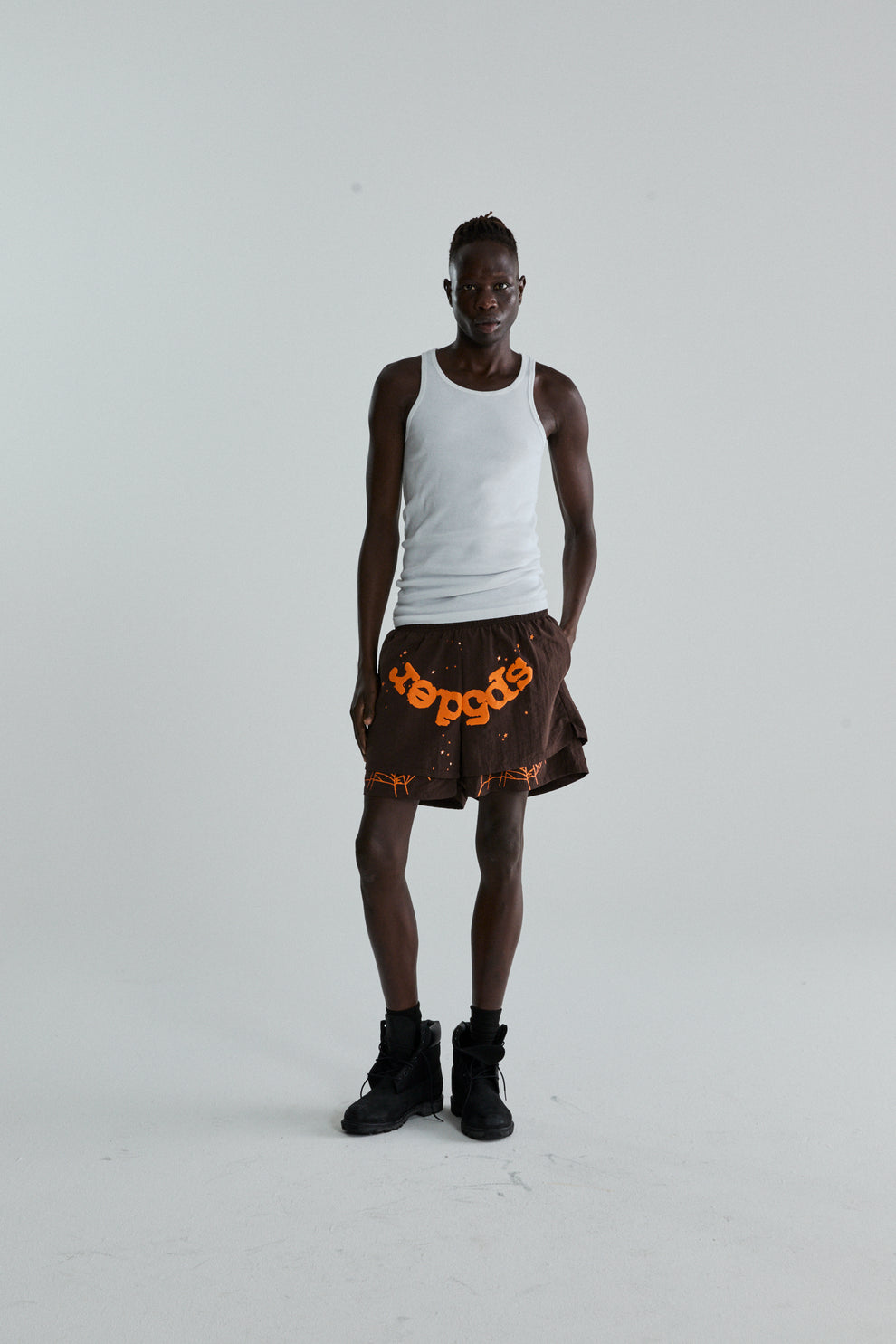 BROWN OG WEB DOUBLE LAYER SHORTS ON MODEL
