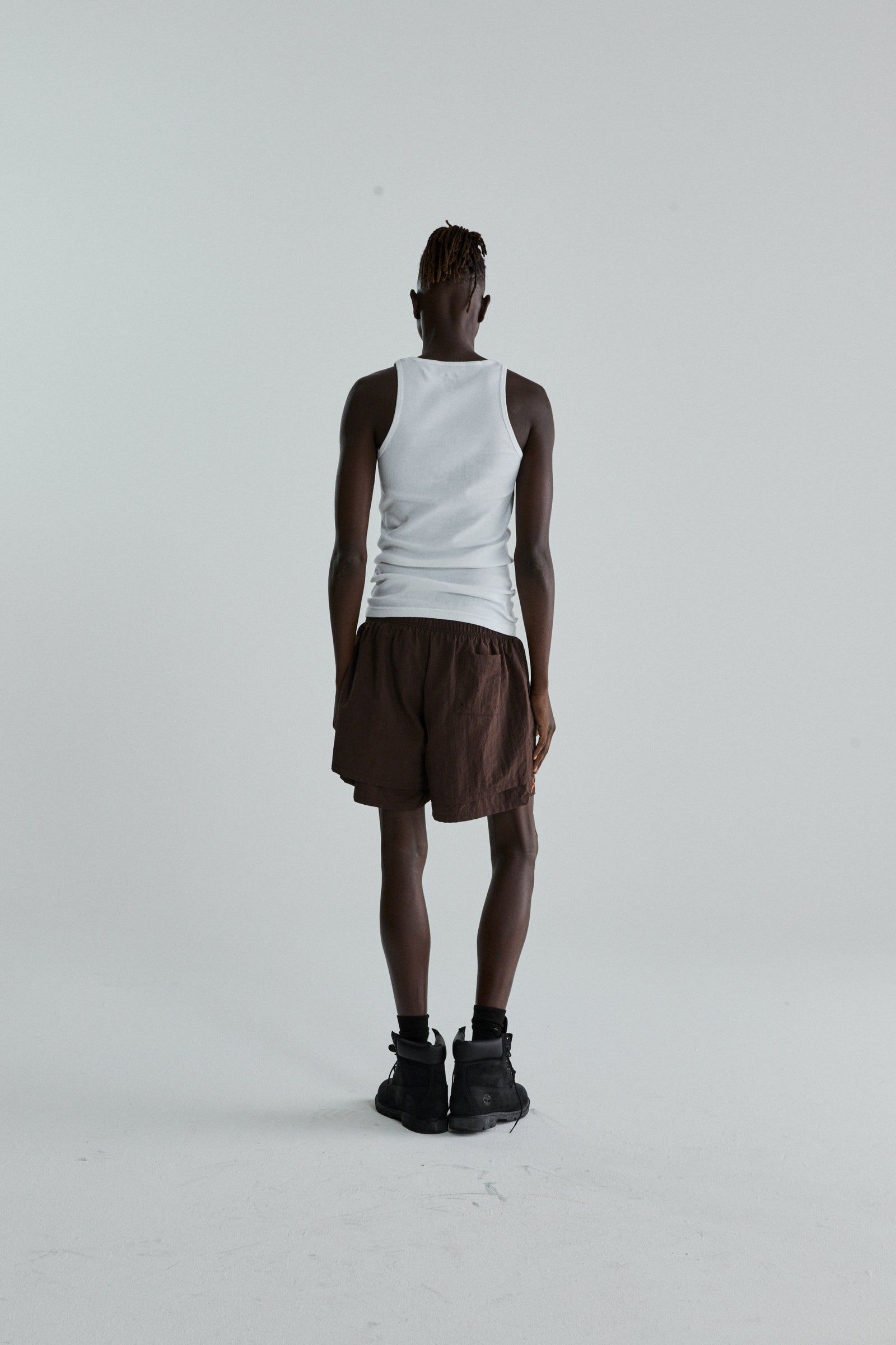 BROWN OG WEB DOUBLE LAYER SHORTS ON MODEL