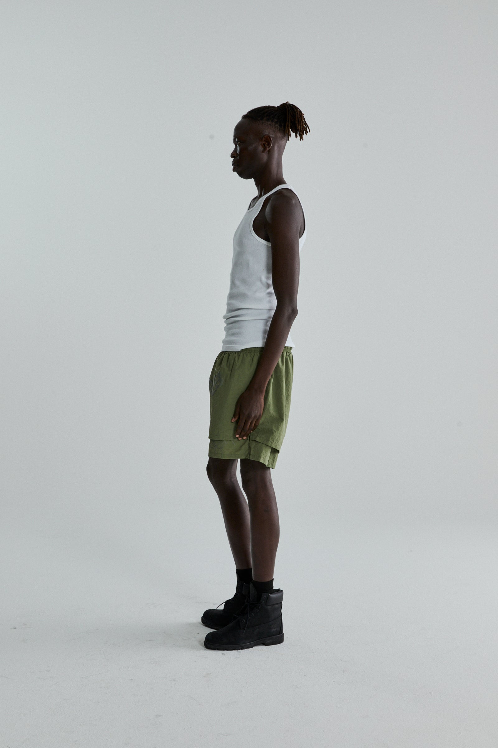 SAGE GREEN OG WEB DOUBLE LAYER SHORTS ON MODEL