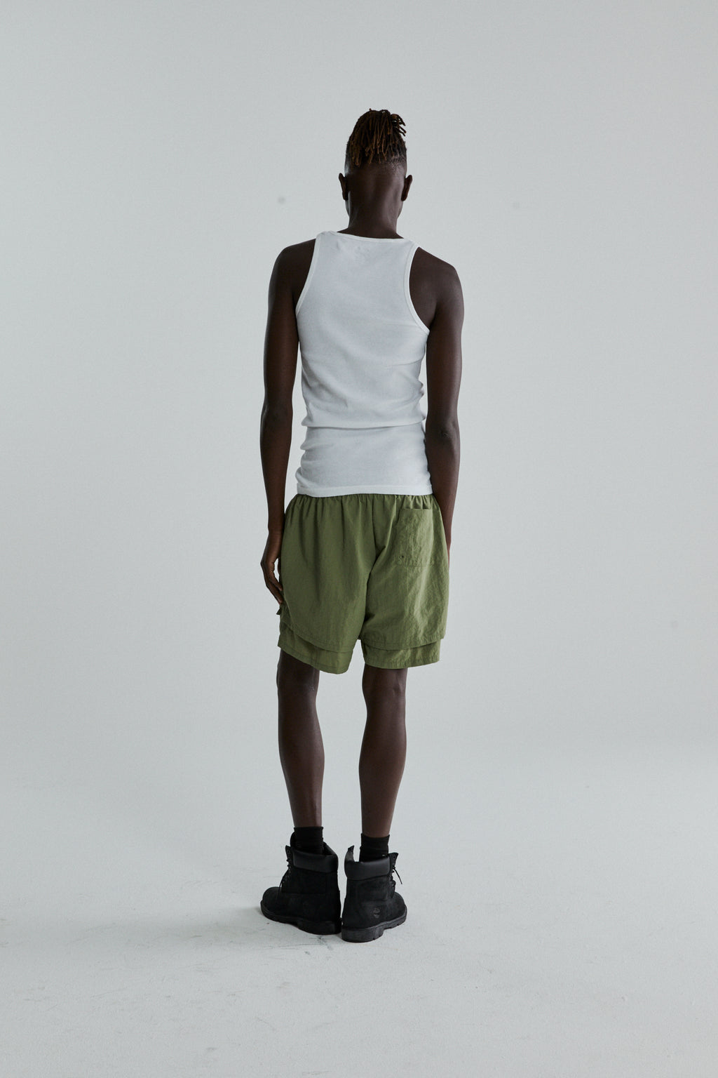 SAGE GREEN OG WEB DOUBLE LAYER SHORTS ON MODEL