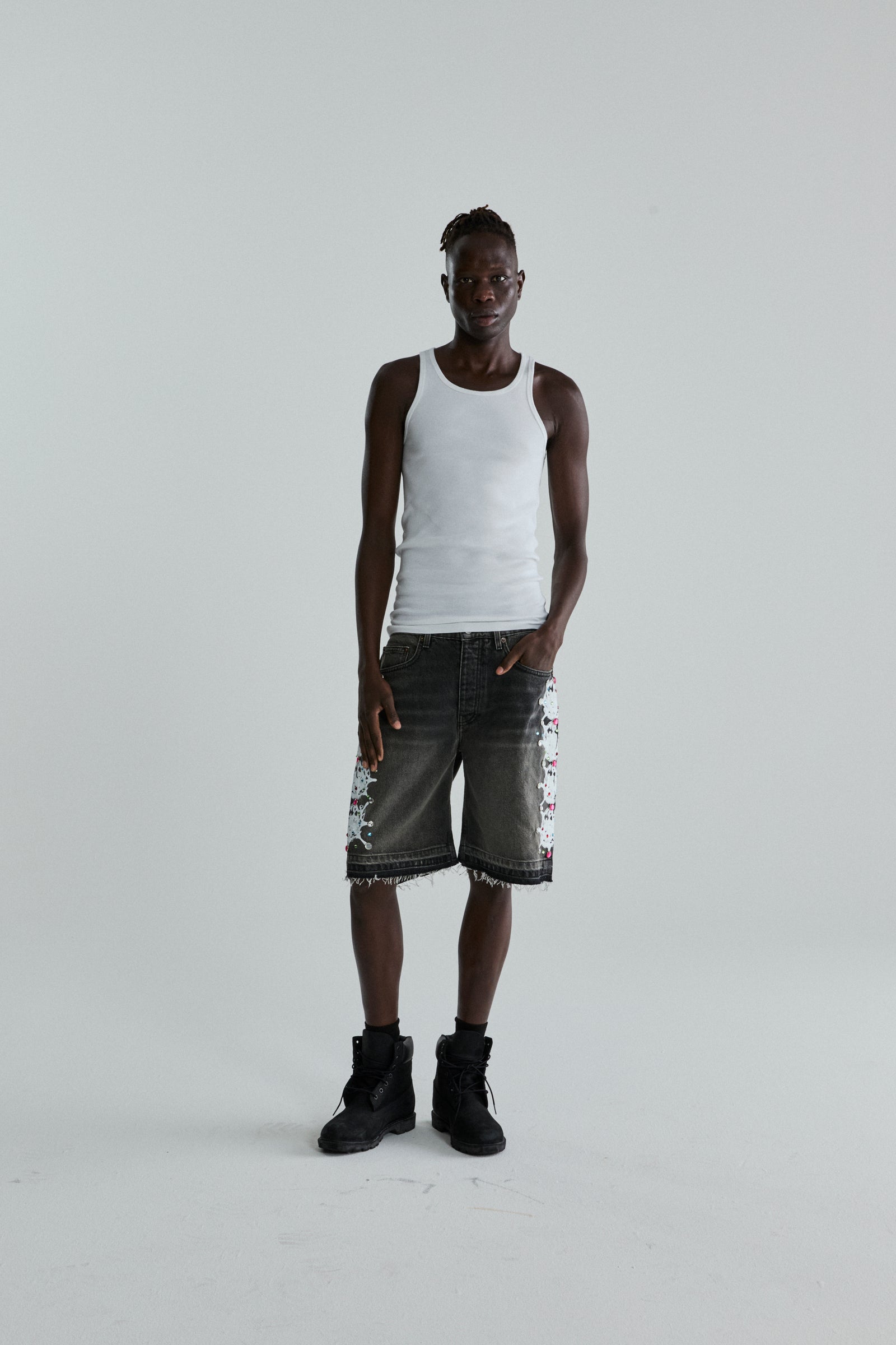 BLACK WASH WEB STONE DENIM SHORTS ON MODEL
