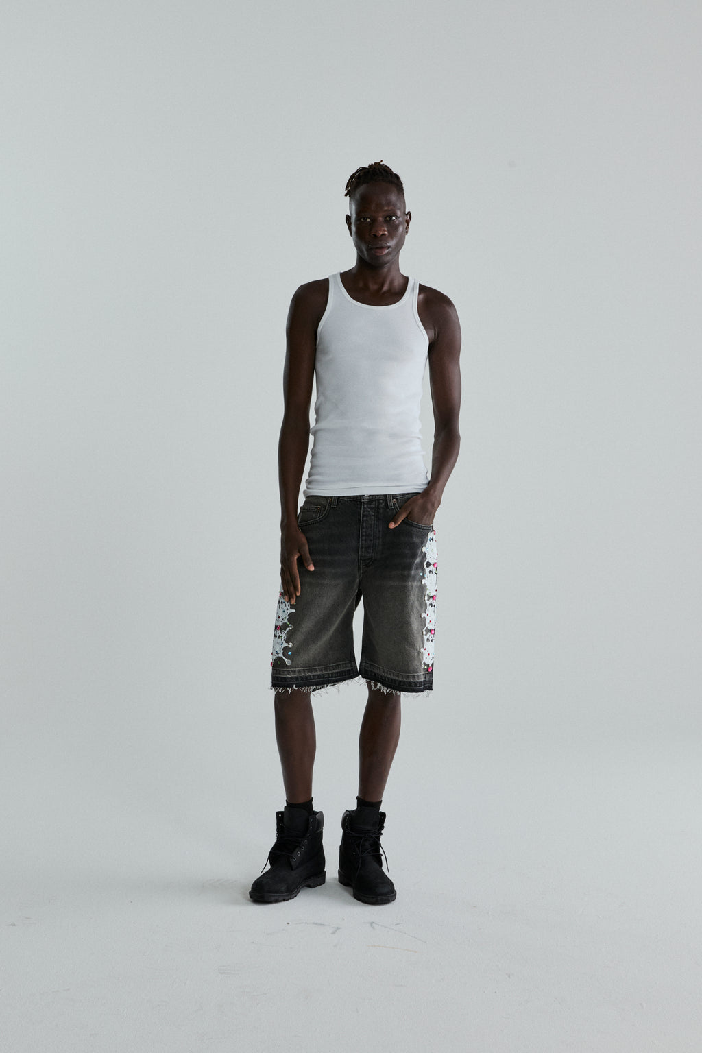 BLACK WASH WEB STONE DENIM SHORTS ON MODEL