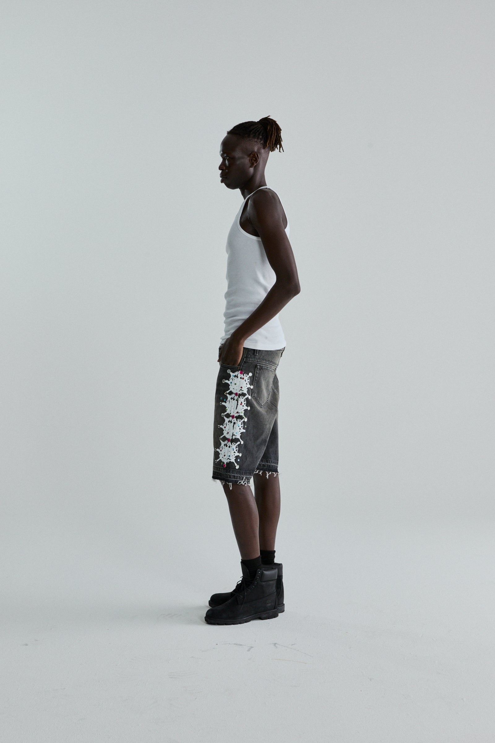 BLACK WASH WEB STONE DENIM SHORTS ON MODEL