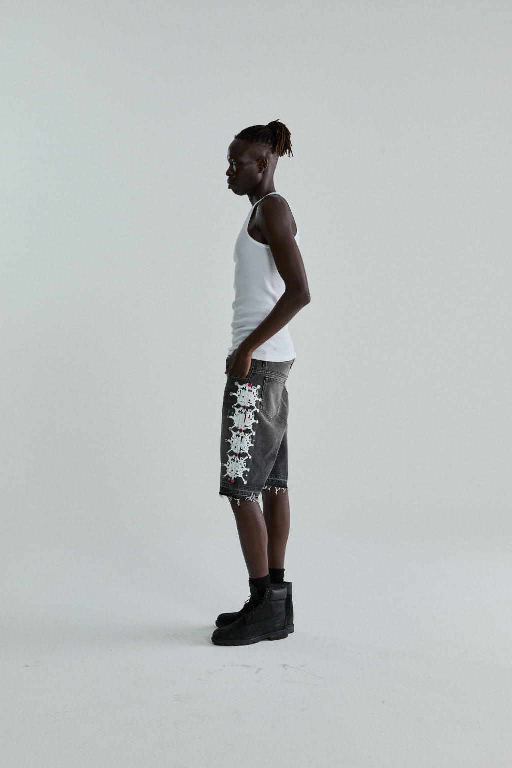 BLACK WASH WEB STONE DENIM SHORTS ON MODEL