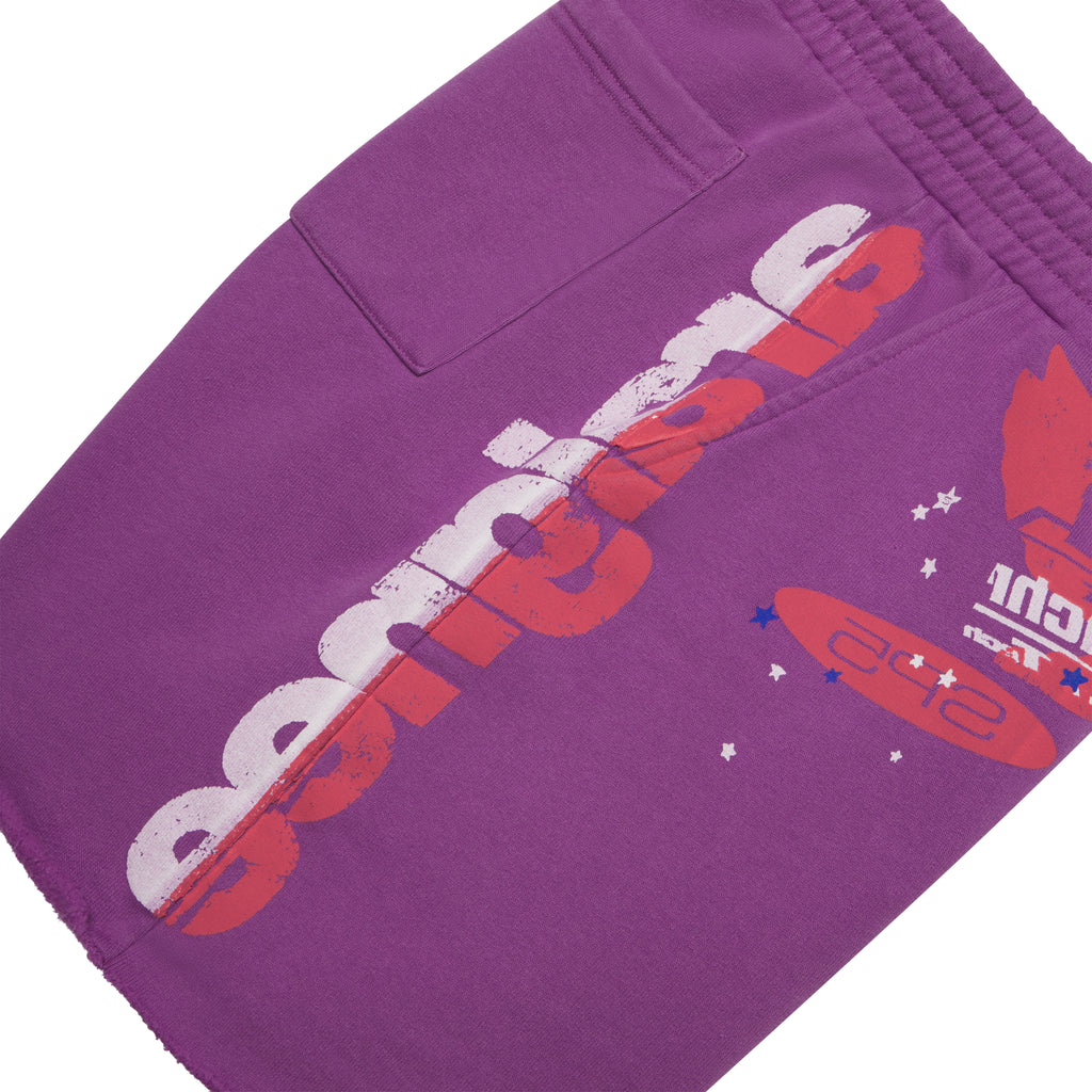 Purple cotton fleece sweatshorts with red and white graphic print, drawcord waist, and raw hem.