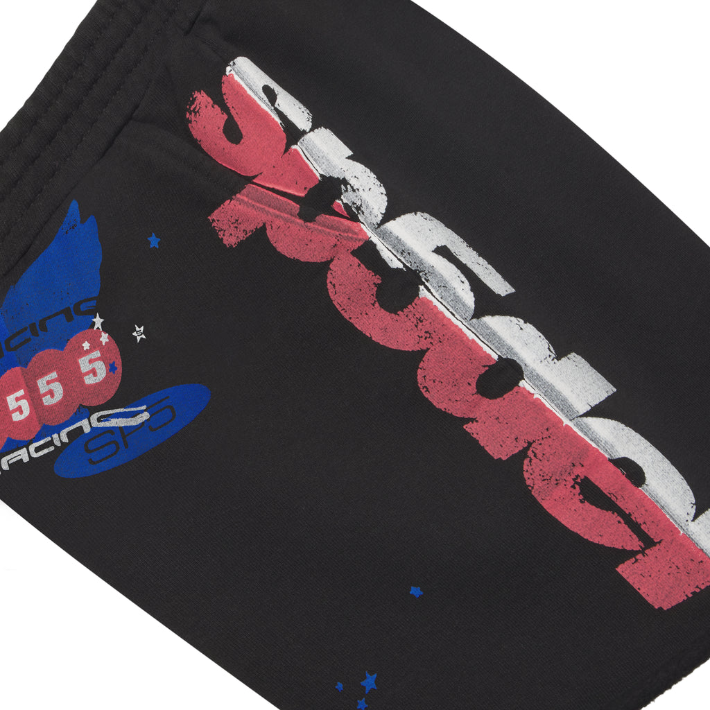 Black cotton fleece sweatshort with red, white, and blue graphic print, drawcord waistband, and raw hem.