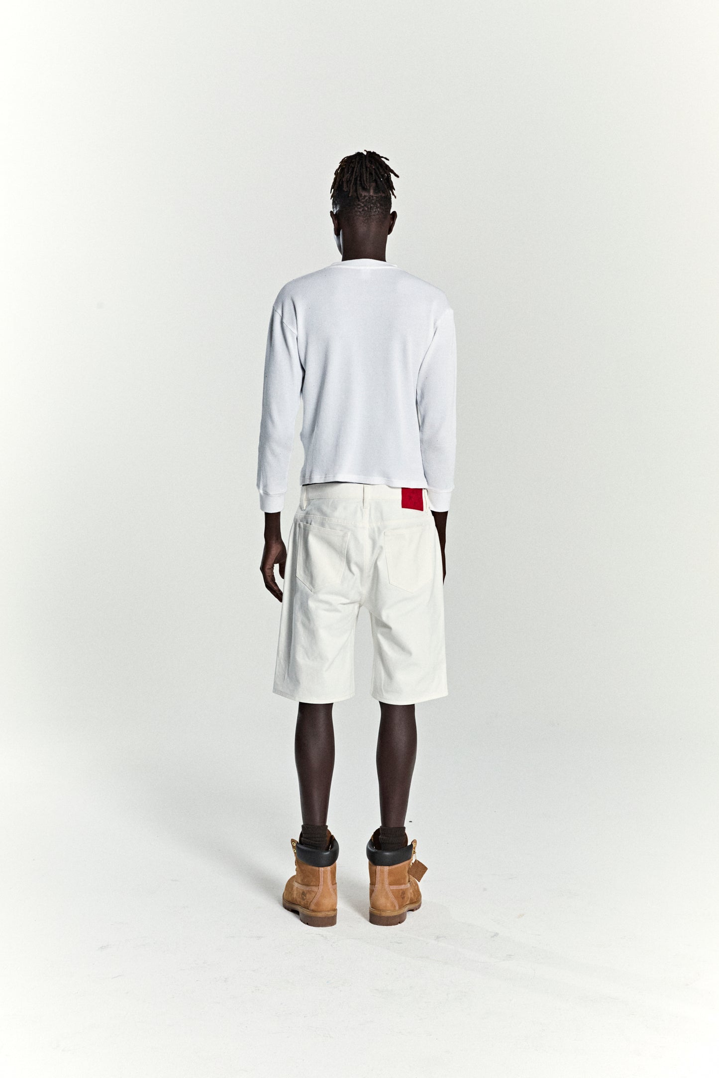 WHITE V3 LOGO DENIM SHORT ON MODEL