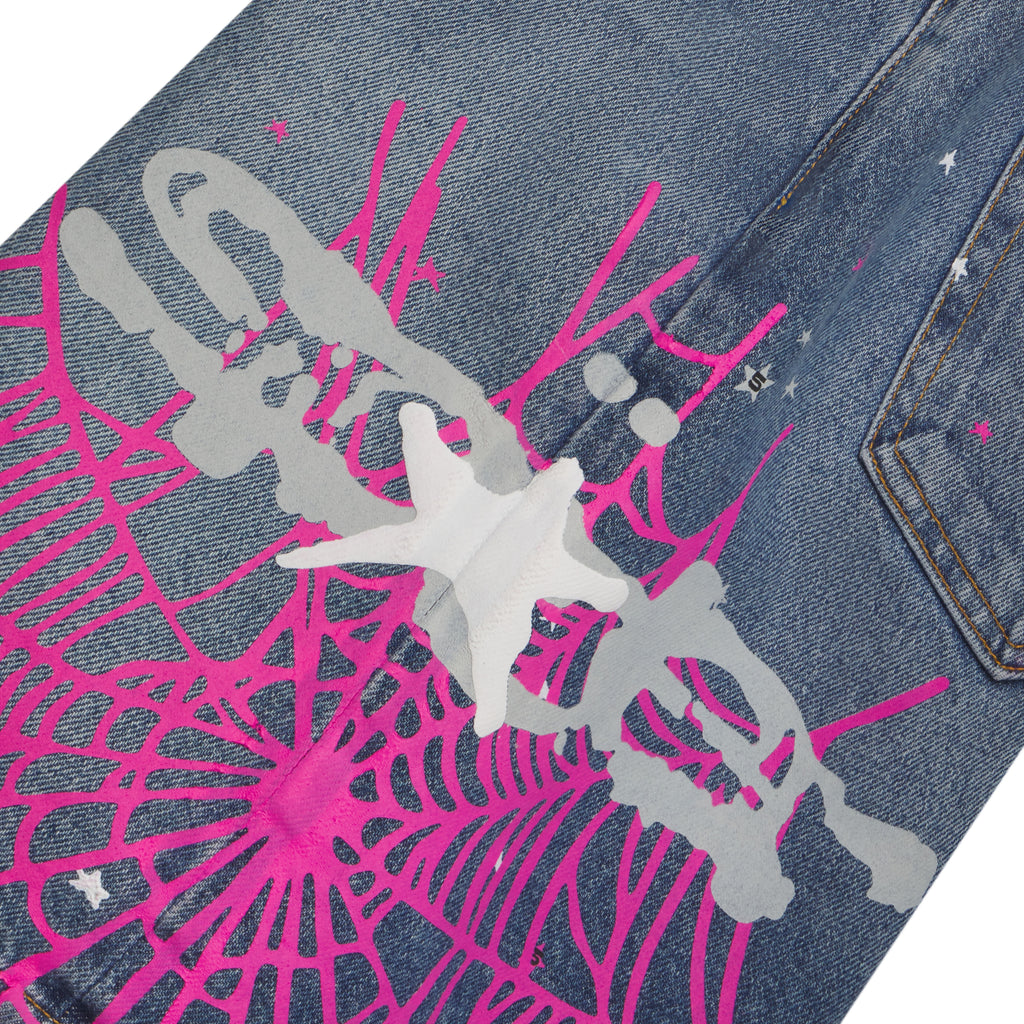 Blue denim short with pink web print, gray splatter, and scattered white stars.