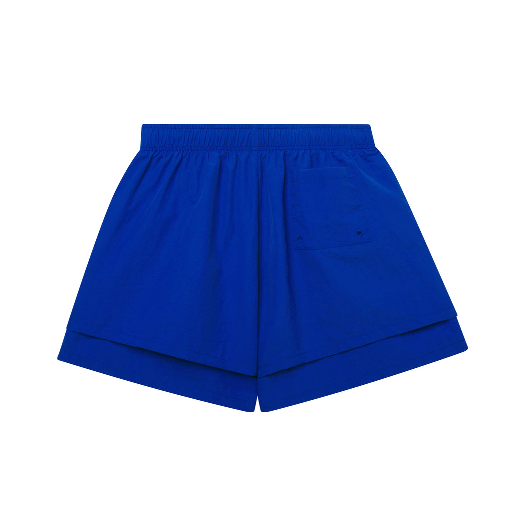 BELUGA DOUBLE LAYER SHORT: Blue 4oz water repellent nylon shorts with high-low double layer design and patch back pocket.