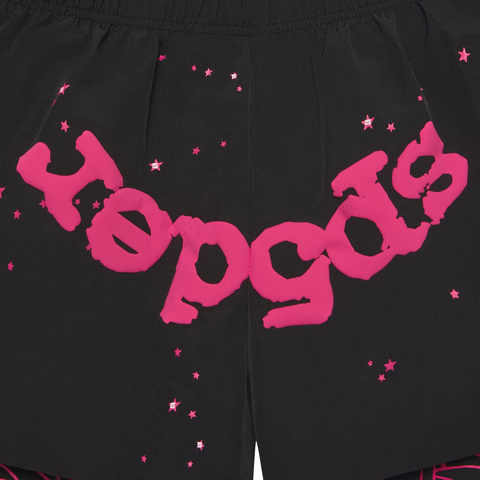 Black water-repellent nylon shorts with pink "Sp5der" text, star print, and elastic waistband.