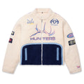 Cream sherpa moto jacket with navy bottom panel, custom SP5DER patches, and "HUNTERS" embroidery.