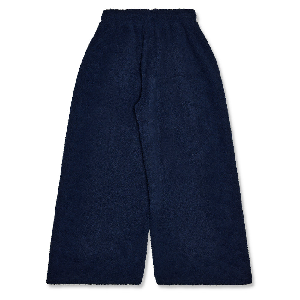Navy blue sherpa wide leg globe pant with drawstring waist and worldwide patch.