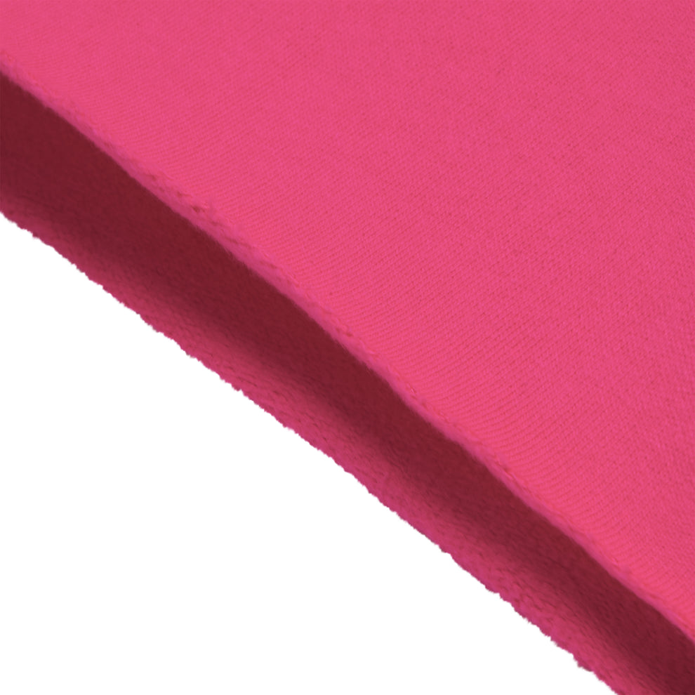 Close-up of vibrant pink Beluga sweatshort fabric, showing brushed fleece texture and raw hem detail.