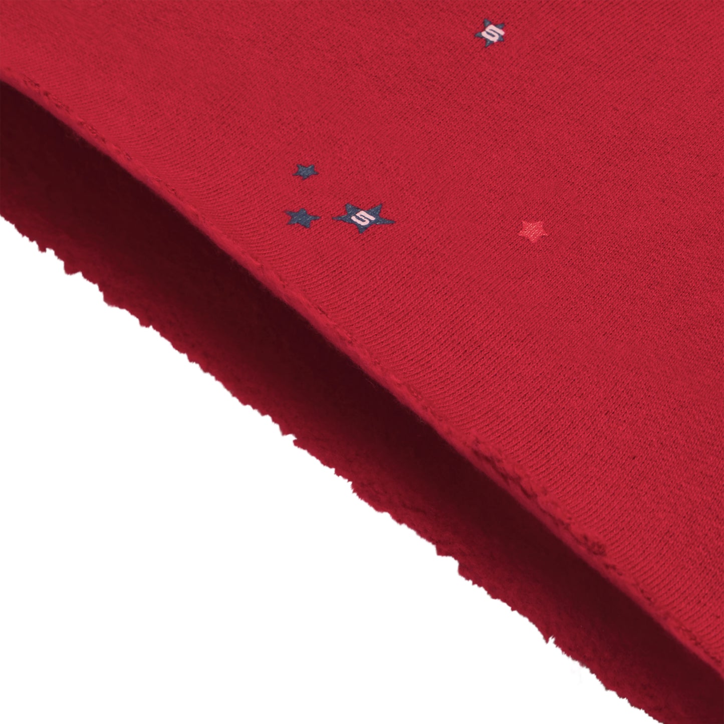 Red 13oz cotton brushed fleece shorts with scattered star print and raw hem.