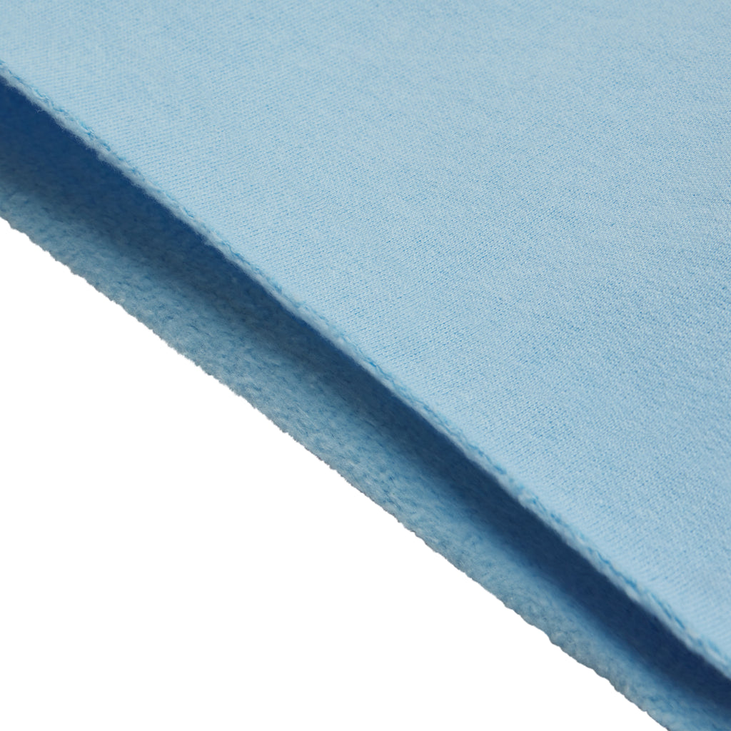 Light blue 13oz cotton brushed fleece fabric with a raw hem, showing soft texture.