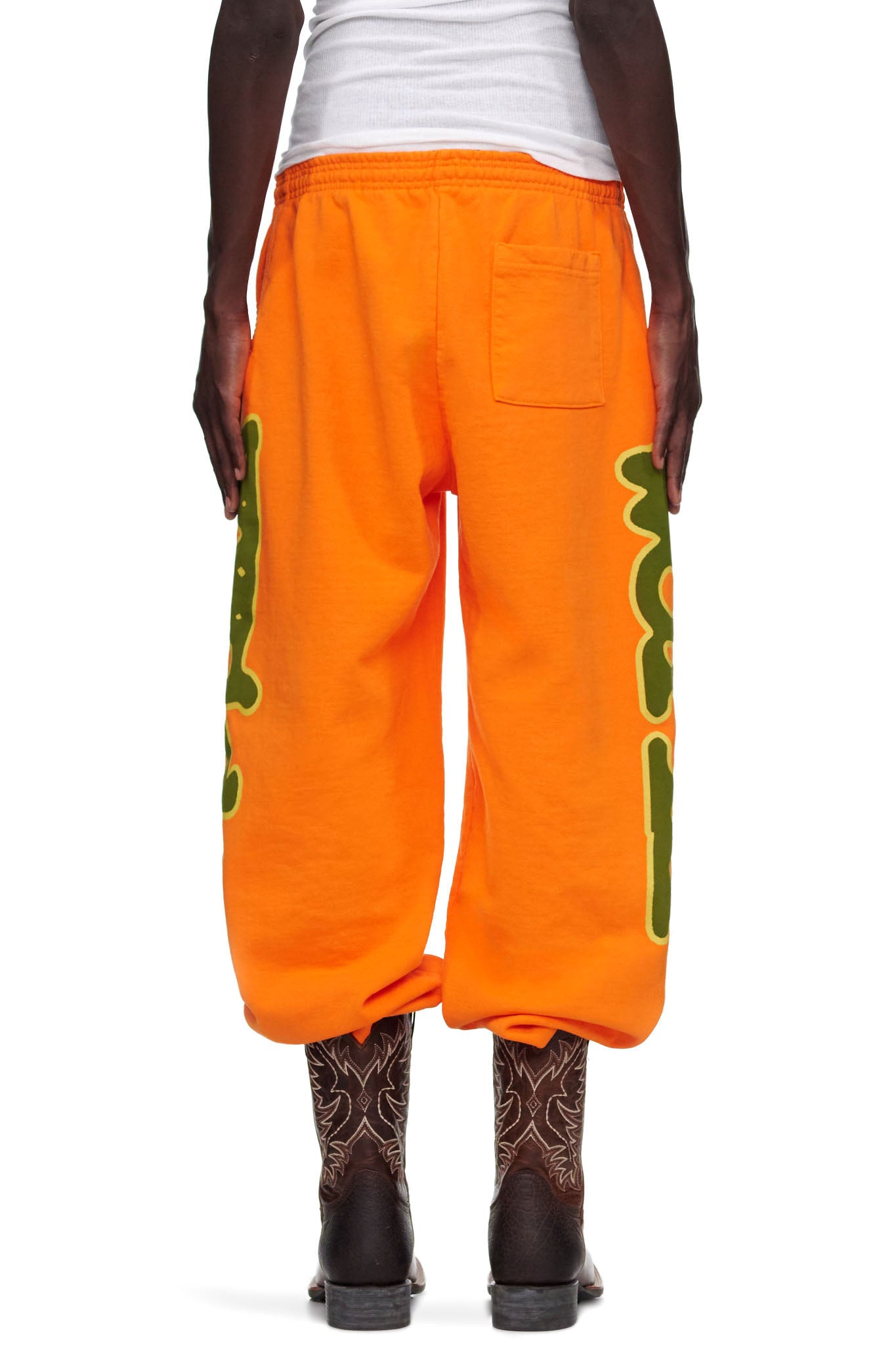 Orange 23oz fleece BELUGA SWEATPANT with green 'Worldwide' puff print down both legs.