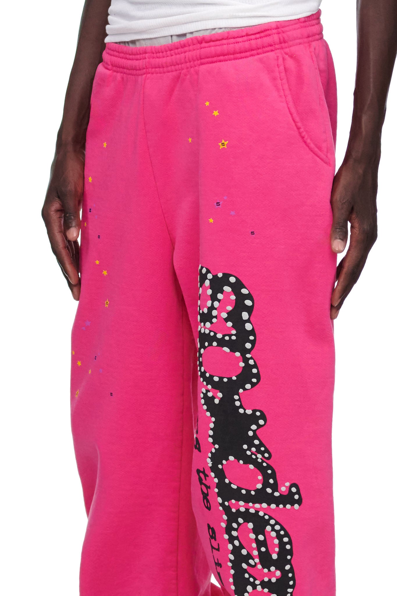 Pink P*NK V2 sweatpants with black puff print and discharge print, SP5DER motif, and star prints.