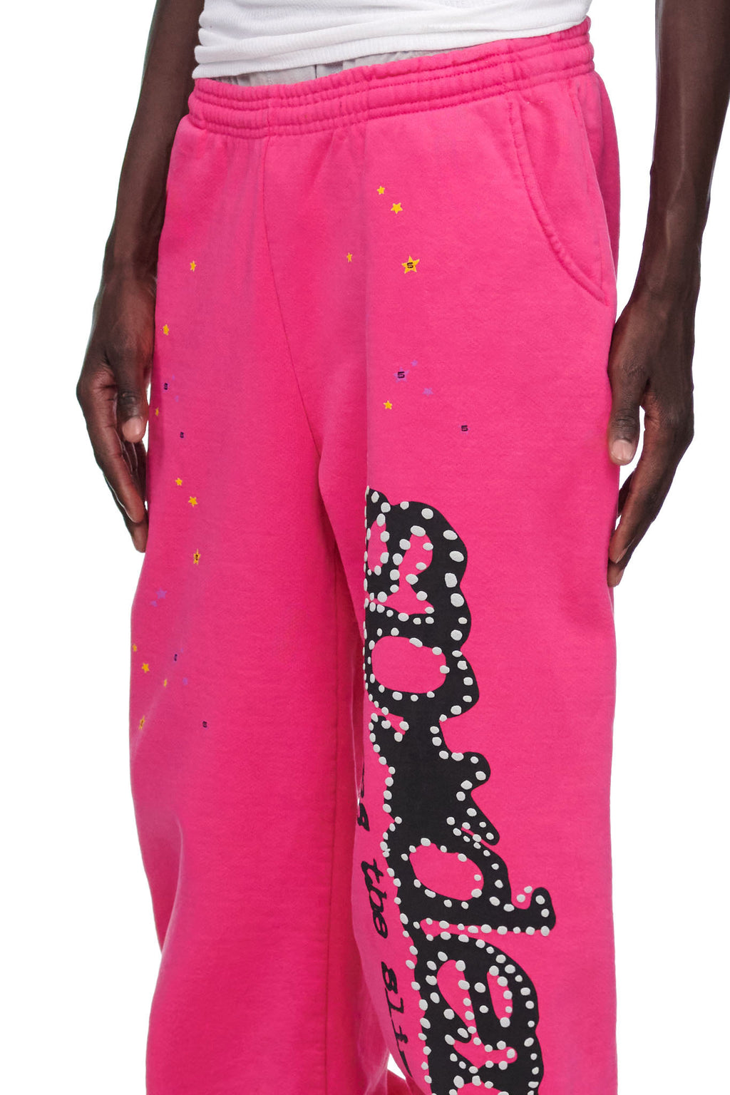 Pink P*NK V2 sweatpants with black puff print and discharge print, SP5DER motif, and star prints.