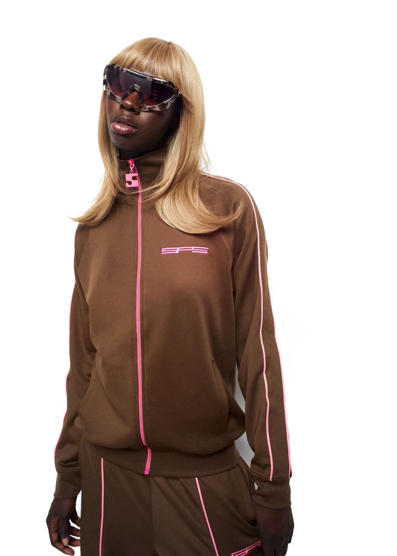 Brown poly blend track jacket with pink stripes, SP5 logo, and full zip.