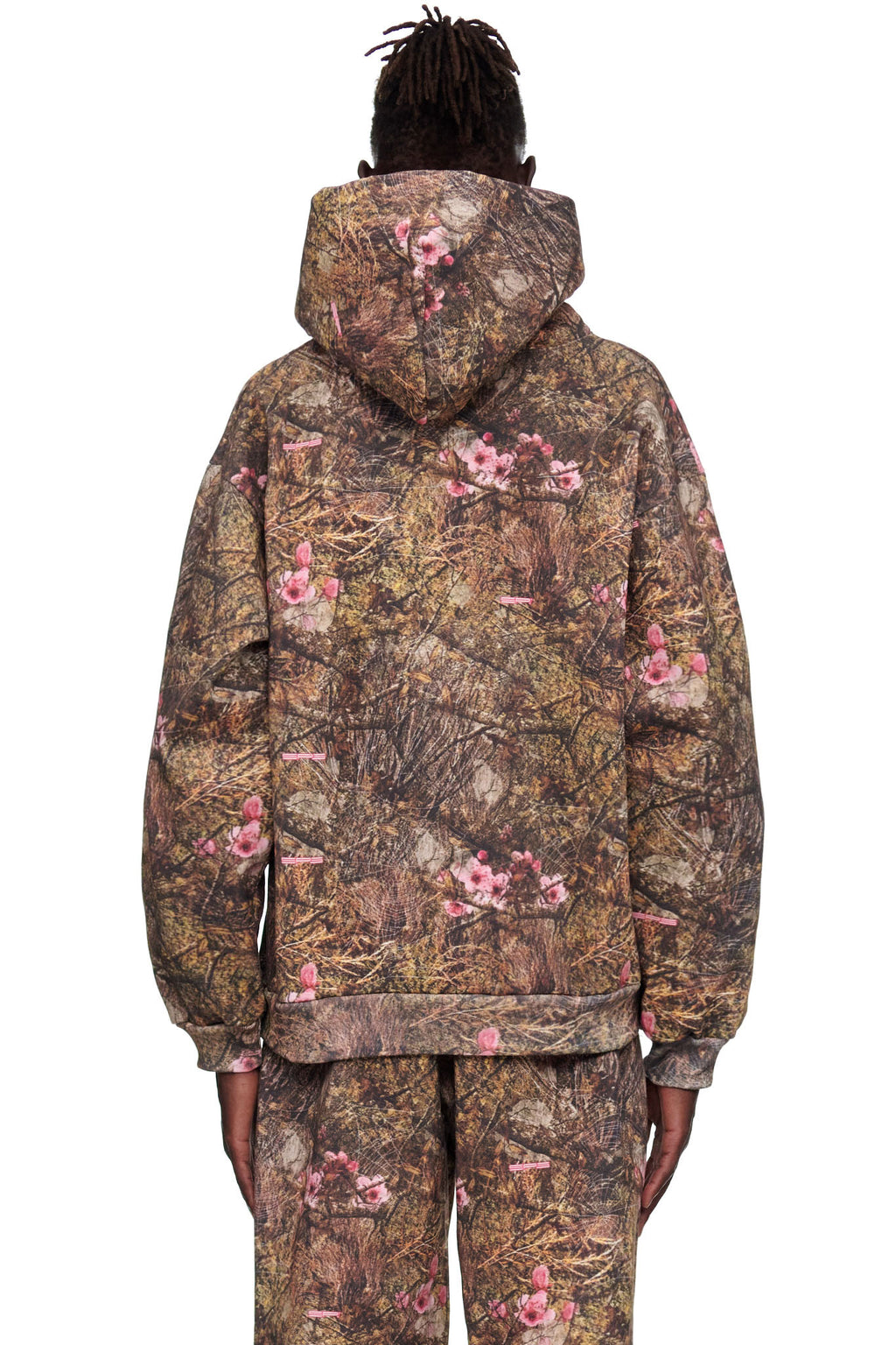 REAL TREE OG WEB HOODIE, 23oz fleece, brown camo with pink floral print, worn by male model.